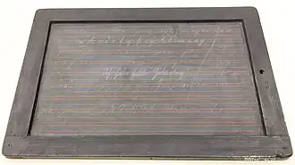 Writing slate, showing calligraphy exercise