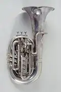 Photograph of a small French C tuba with six valves