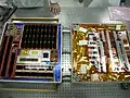 MISSE PEC5 being prepared for launch. On the left is FTCSE, on the right PcSat-2 covered and by a golden thermal blanket with the flexible materials samples