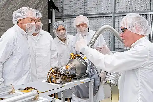 U.S. and Japanese team members with the gamma-ray spectrometer portion of the MEGANE instrument at Johns Hopkins APL.