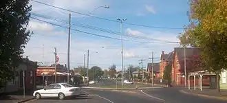 Macarthur Street, main commercial area of Soldiers Hill looking east; North Britain Hotel is on the left, Macarthur St. Primary is on the right