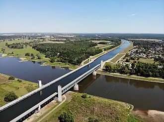 A bridge carrying canal with water, passing over a valley