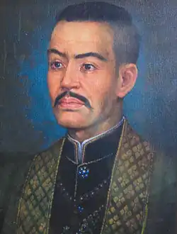 A portrait of Maha Sura Singhanat seated on a dais.