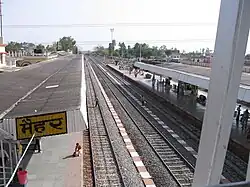 An outdoor railway station, seen from above