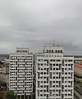 Renovated high-rises of the complex in 2020, without brick, with the concrete painted white