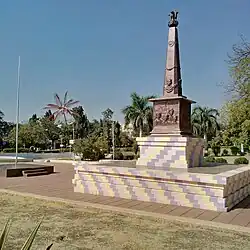Cross view of the monument, with flag pole in front