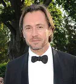 Designer Marc Newson pictured at a gala reception wearing evening dress.