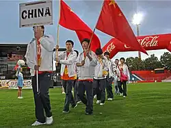 Chinese delegates with the Chinese flag marching into the stadium for the World Sports Festival.