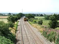 A Class 158 diesel multiple unit running northwards from Shrewsbury to Crewe