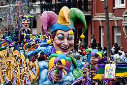Doubloons are thrown from Mardi Gras floats such as this one