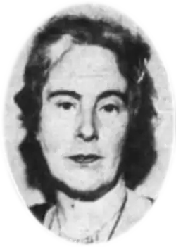 A black-and-white photograph of a woman's head