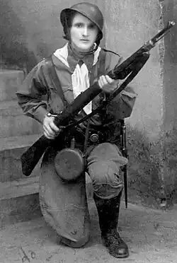 Female soldier with a rifle, kneeling