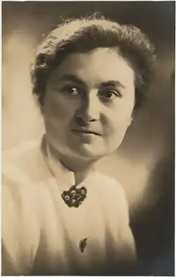 A woman in a white blouse