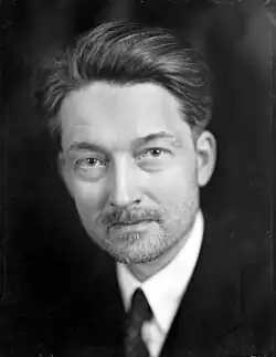 Black-and-white head shot photograph of Maritain looking toward the camera