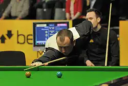 Mark Williams playing a shot