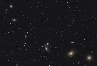 NGC 4402 visible in an image of Markarian's Chain. Click the image then move the cursor over it to reveal the location of NGC 4402.