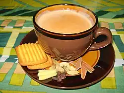 Northern India's most popular way to drink tea, masala chai, served with tea biscuits