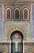 Mihrab of the mausoleum chamber, with stucco and tile decoration