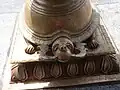 Tortoise-shaped base of the peacock-faced lamp in front of the Valampuri Vinayakar