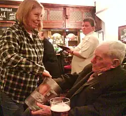 A customer draws a ticket from the pot