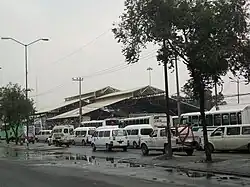 The station covered by several minibuses.