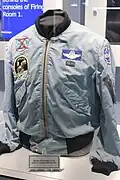 The jacket worn by Michael Collins featuring patches for Apollo 11 and other missions he flew on