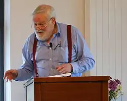 Longley reading his poetry in 2012