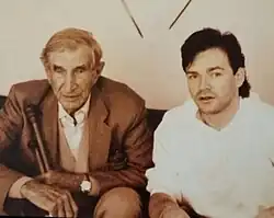 Sir Wilfred Thesiger seated beside Michael Elmore-Meegan