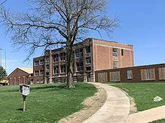 The original Miles School building prior to its partial demolition in 2019, making way for a new Easton Valley Elementary School.