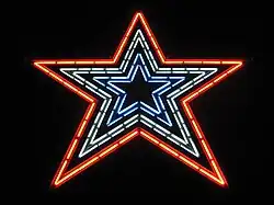 The Star with red, white, and blue neon lights illuminated.