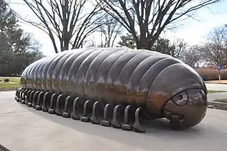 A large bronze statue of a millipede