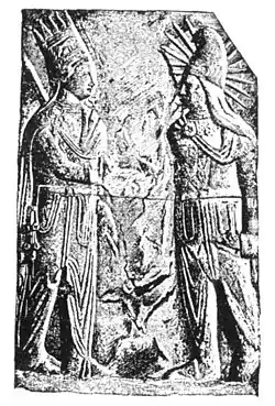 Mithras-Helios (right), with solar rays and in Iranian dress,[26] with Antiochus I of Commagene (Mt. Nemrut, 1st century BCE)