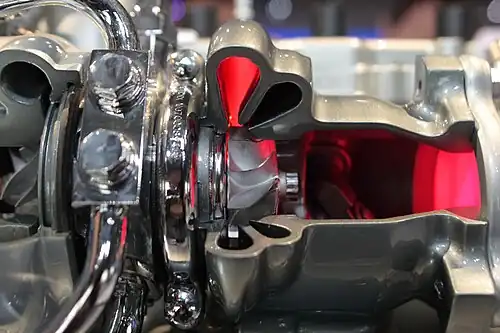 Cutaway view showing the two scrolls of a Mitsubishi twin-scroll (the larger scroll is illuminated in red)