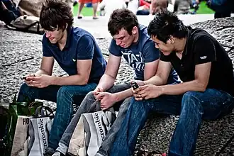 Image 111Young men in London, 2010, wearing slim-cut jeans and layered T-shirts and polos, typical of middle-class streetwear influenced by Abercrombie & Fitch. (from 2010s in fashion)