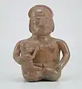 Moche ceramic vessel showing a woman breastfeeding. Larco Museum Collection. Lima-Perú