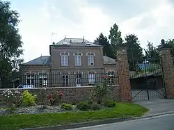 The town hall and school in Molliens-au-Bois