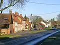 The village seen from the main road (A4010) in 2009.