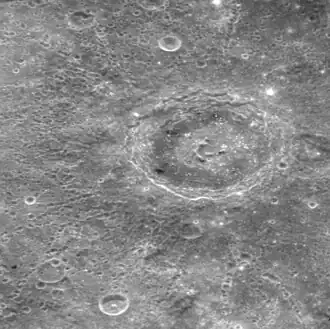 Note the unusual ring of dark floor material around the central peak