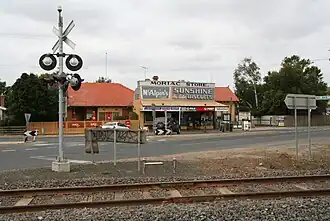 General store and railway crossing on the main street