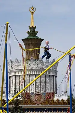 Child using a bungee cord ride in a park in Moscow