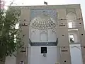 A view of the upper part of the main entrance, showing muqarnas work present