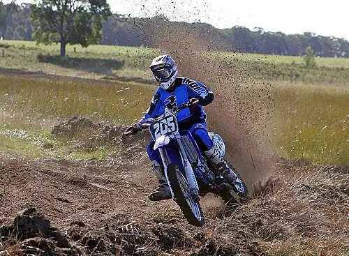 Image 10 Motocross Credit: Fir0002 Motocross is form of motorcycle or ATV racing held on enclosed off-road circuits. The tracks are often quite large, natural, terrains with very few man made jumps, unlike Supercross, a sport that was originally derived from Motocross and is executed on a smaller track with many more extreme man made obstacles. More selected pictures