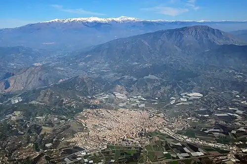 Aerial view of Motril, with snowy mountains in the background