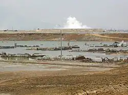Scale of the mud hole, with efforts to contain it using embankments