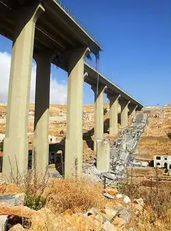 damaged span of the bridge after partial implosion