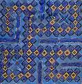 Tile from a 14th-century mausoleum in Uzbekistan, inscribed with Muhammad's name (محمد) in square Kufic; one of a set used to frame a doorway