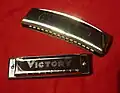 Harmonica (rear) and Blues harp (front)