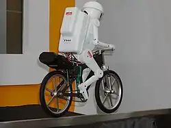 Murata Boy, a 50 cm (20") high bicycle-riding robot developed by the company since 1991 (2005 Model pictured).