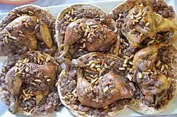 Musakhan, a Palestinian dish—chicken with onions, spices and pine nuts on taboon bread
