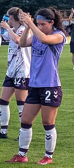 Player on the pitch clapping and looking badass